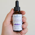 Moonlit Lavender & Vanilla body and massage oil in a relaxing self-care setting