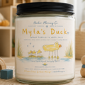 Myla's Duck soy candle in a playful coastal setting