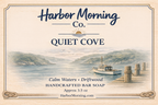 Harbor Morning Co. Quiet Cove handcrafted goat milk soap label featuring calm cove waters, driftwood, and a small fishing boat tied to a pier