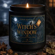 Witch's Window gothic soy candle in a spooky Halloween setting